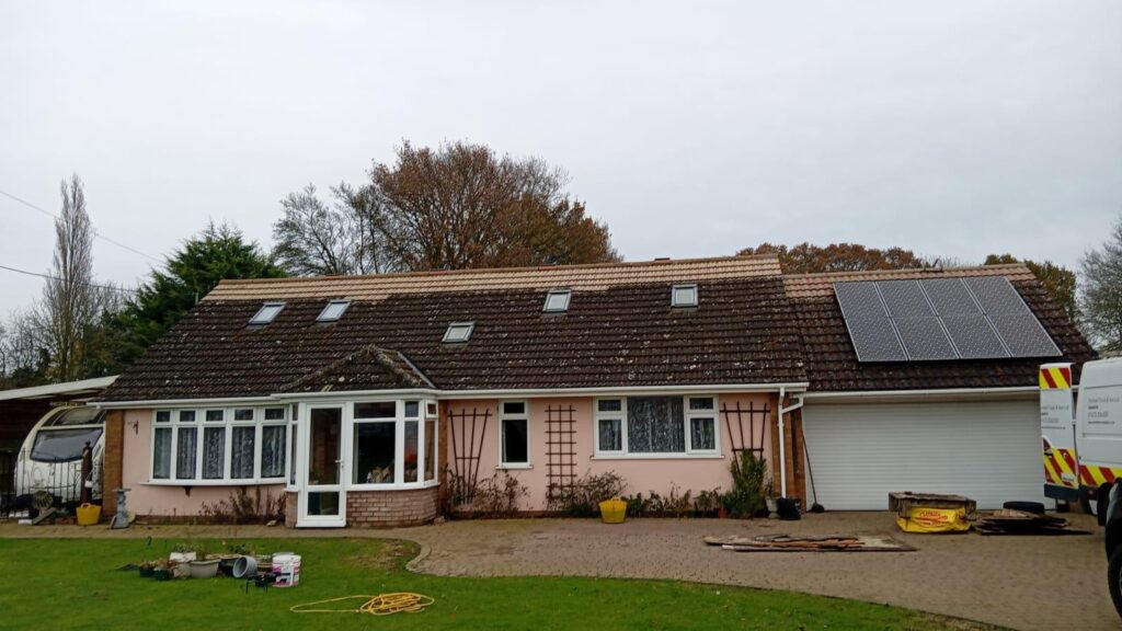 Roof tiles after cleaning and application of Properla Tile Red protective coating